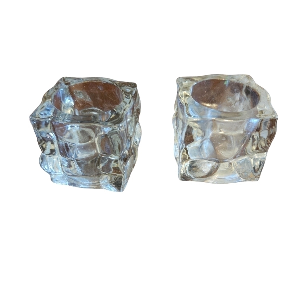 Glass ice cube candle votives.